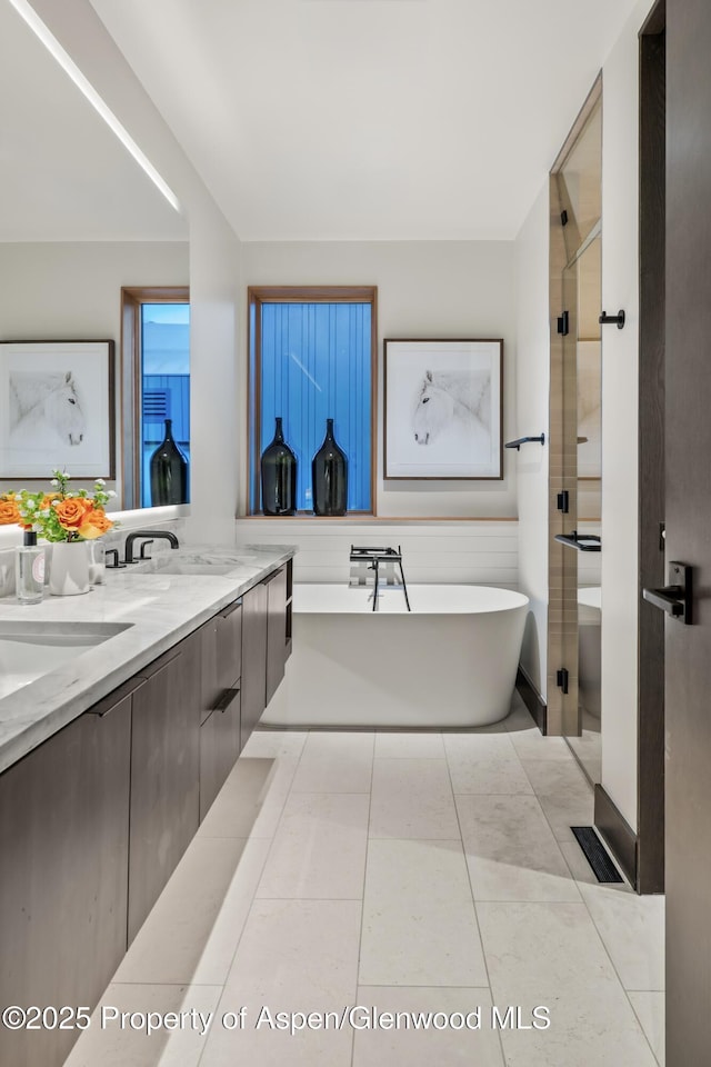 411 Wood Rd Unit 10, Snowmass Village, CO 81615 - full bath with a freestanding tub and double vanity