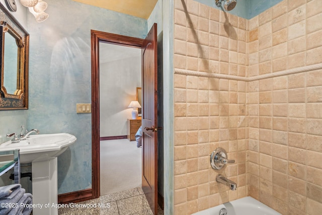 845 Hillcrest Dr, Basalt, CO 81621 - bathroom with washtub / shower combination, a sink, and baseboards
