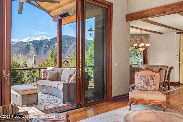 845 Hillcrest Dr, Basalt, CO 81621 - entryway with wood finished floors, a chandelier, a mountain view, baseboards, and beamed ceiling