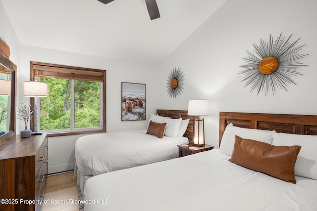 65 Campground Ln Unit 94, Snowmass Village, CO 81615 - bedroom with light wood-style floors, vaulted ceiling, and a ceiling fan
