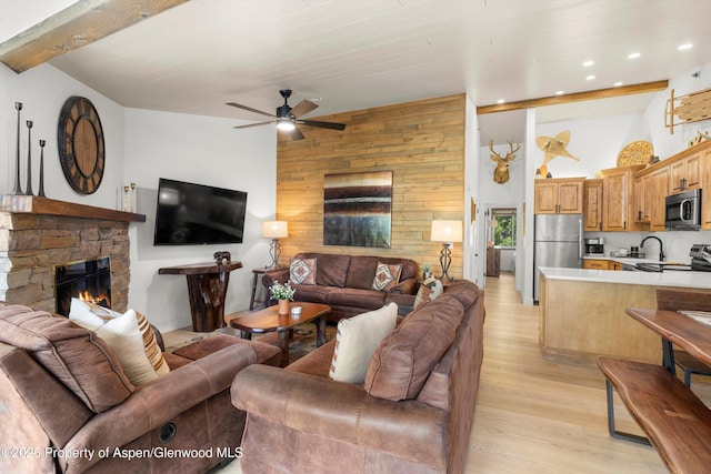 65 Campground Ln Unit 94, Snowmass Village, CO 81615 - living room featuring light wood-style floors, wood walls, ceiling fan, a stone fireplace, and recessed lighting