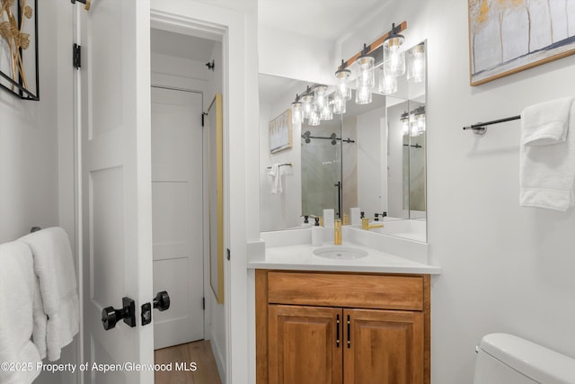 65 Campground Ln Unit 94, Snowmass Village, CO 81615 - bathroom featuring vanity, a shower, and wood finished floors