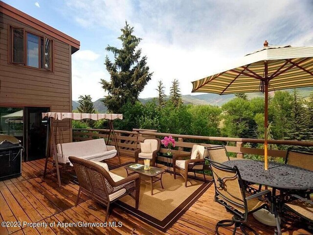 wooden deck featuring outdoor lounge area