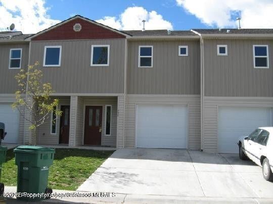 460 Yarrow Cir, Parachute, CO 81635 - view of front of home with an attached garage and concrete driveway