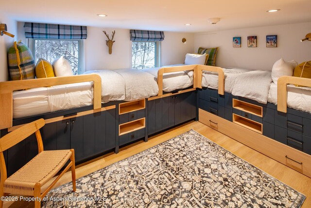 800 S Mill St Unit 201C, Aspen, CO 81611 - bedroom with light wood-style flooring and recessed lighting