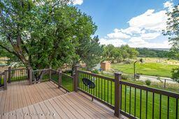 8984 County Road 300, Parachute, CO 81635 - wooden deck featuring a yard