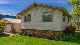 8984 County Road 300, Parachute, CO 81635 - view of side of property with a lawn