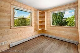 8984 County Road 300, Parachute, CO 81635 - spare room with wood finished floors and wood walls