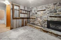 8984 County Road 300, Parachute, CO 81635 - unfurnished living room featuring a stone fireplace
