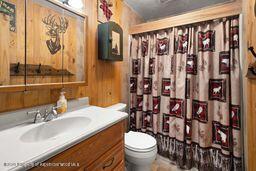 8984 County Road 300, Parachute, CO 81635 - bathroom with vanity and curtained shower