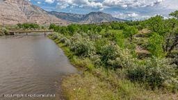 8984 County Road 300, Parachute, CO 81635 - water view with a mountain backdrop