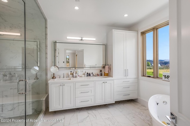 577 Fox Run Dr, Carbondale, CO 81623 - full bath with recessed lighting, plenty of natural light, marble look tiles, a marble finish shower, and double vanity