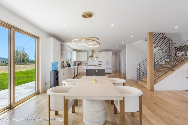 577 Fox Run Dr, Carbondale, CO 81623 - dining area featuring stairway, plenty of natural light, recessed lighting, and light wood-style flooring