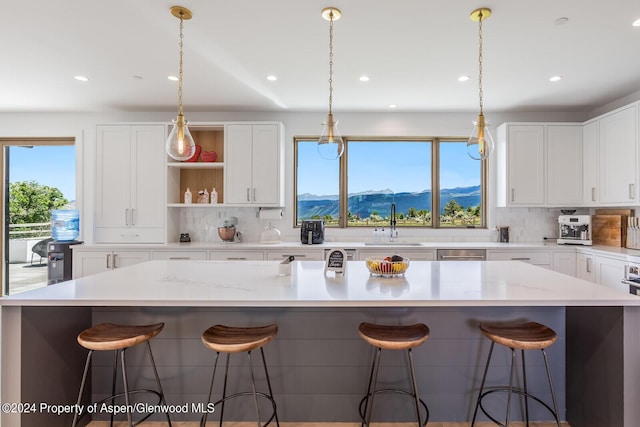 577 Fox Run Dr, Carbondale, CO 81623 - kitchen featuring decorative backsplash, open shelves, recessed lighting, and white cabinetry