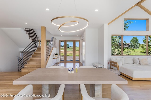577 Fox Run Dr, Carbondale, CO 81623 - dining area with french doors, stairway, recessed lighting, light wood-type flooring, and lofted ceiling