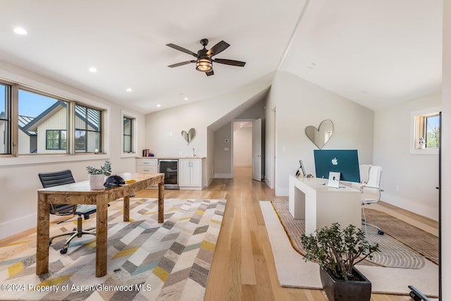 577 Fox Run Dr, Carbondale, CO 81623 - office featuring beverage cooler, bar, light wood-type flooring, vaulted ceiling, and ceiling fan