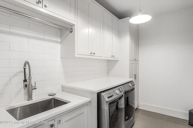 577 Fox Run Dr, Carbondale, CO 81623 - washroom featuring separate washer and dryer and cabinet space