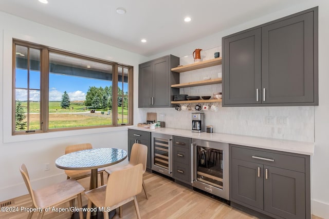 577 Fox Run Dr, Carbondale, CO 81623 - indoor dry bar with wine cooler, healthy amount of natural light, backsplash, light wood finished floors, and recessed lighting