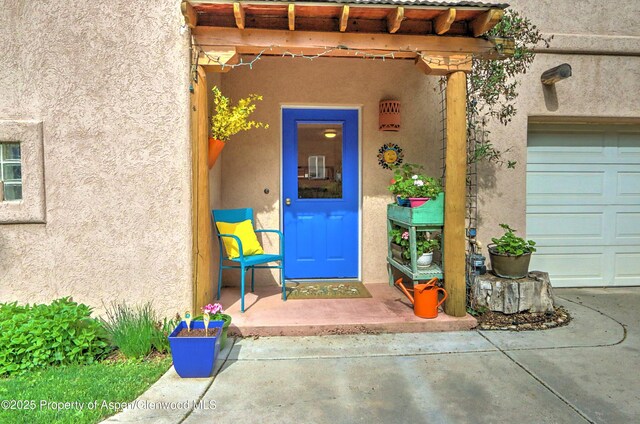 48 Creekside Ct, Glenwood Springs, CO 81601 - entrance to property featuring stucco siding and a garage