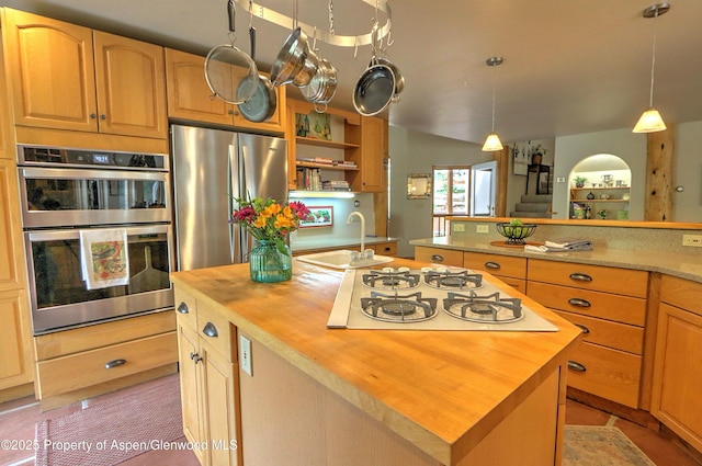48 Creekside Ct, Glenwood Springs, CO 81601 - kitchen featuring wooden counters, stainless steel appliances, a sink, an island with sink, and hanging light fixtures