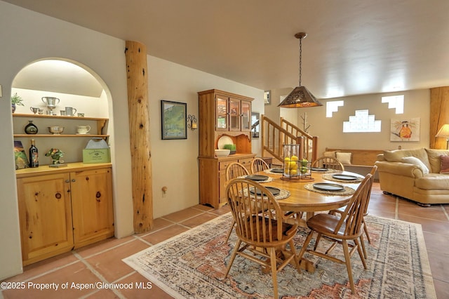 48 Creekside Ct, Glenwood Springs, CO 81601 - dining room featuring light tile patterned flooring and stairway