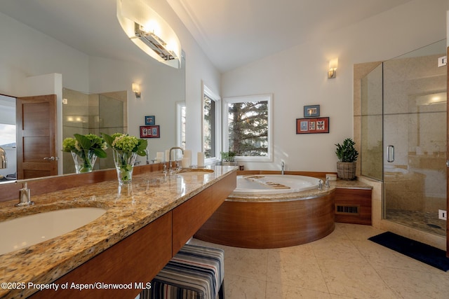 full bath featuring vaulted ceiling, visible vents, a sink, and a shower stall