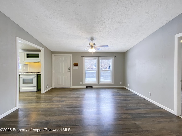 unfurnished living room featuring a textured ceiling, ceiling fan, and dark wood-type flooring