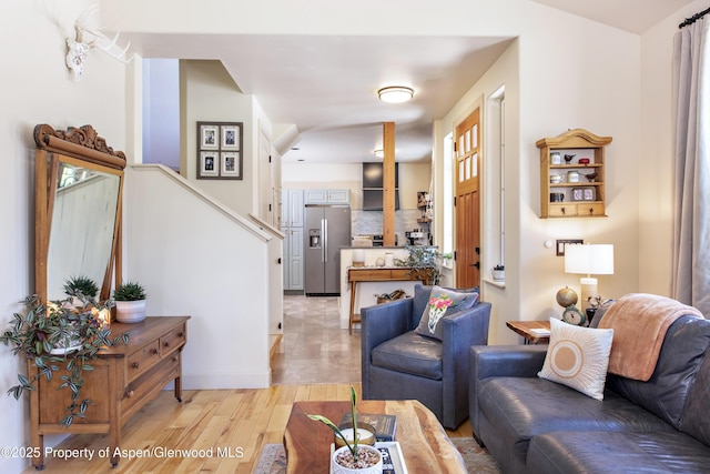 249 Whitehorse Dr, New Castle, CO 81647 - living area featuring light wood-type flooring and stairs