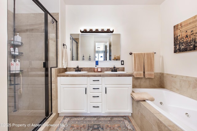 249 Whitehorse Dr, New Castle, CO 81647 - bathroom featuring a tub with jets, a shower stall, and double vanity