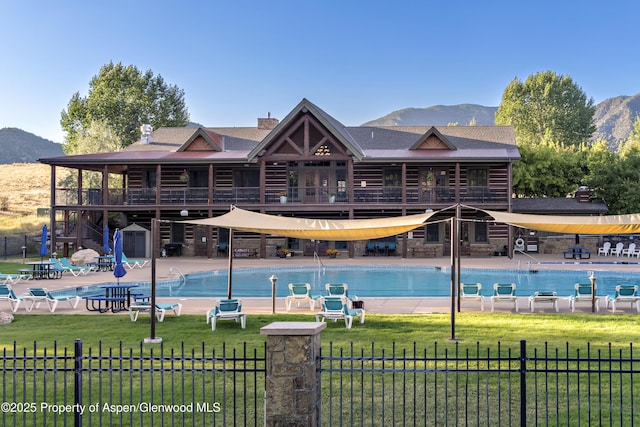 249 Whitehorse Dr, New Castle, CO 81647 - community pool featuring a mountain view, a patio area, and an outbuilding