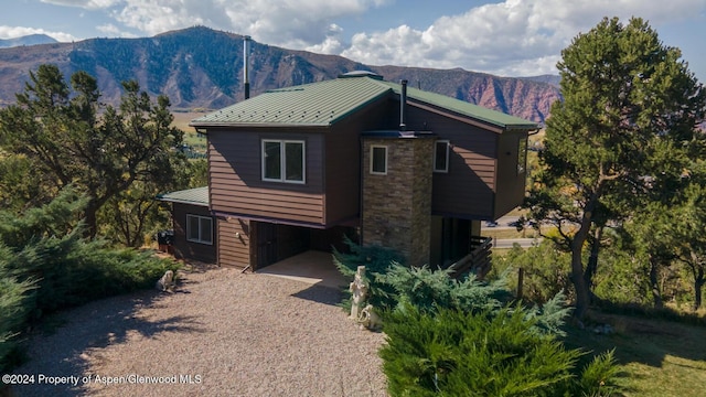 view of property exterior featuring a mountain view