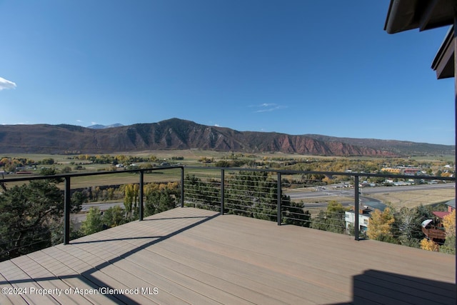 wooden terrace featuring a mountain view