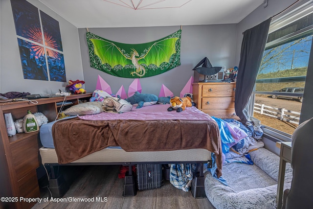 bedroom featuring wood finished floors