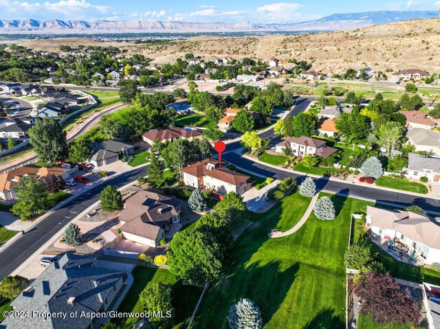 bird's eye view with a residential view and a mountain view