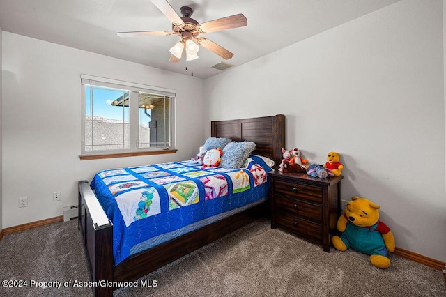 bedroom with visible vents, baseboards, baseboard heating, and carpet