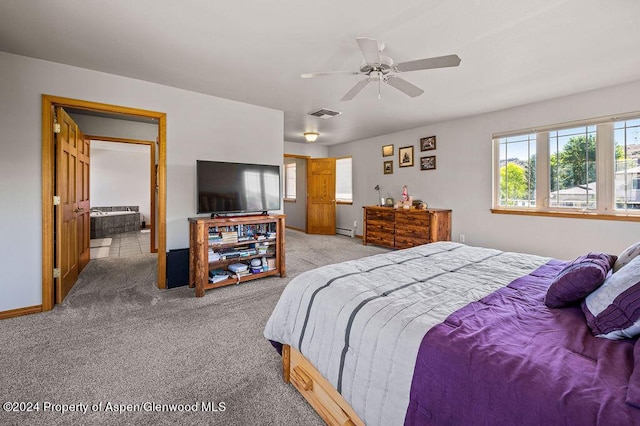 carpeted bedroom with a baseboard heating unit, baseboards, visible vents, and ceiling fan