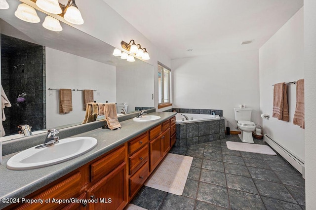 bathroom with baseboard heating, visible vents, a garden tub, and a sink