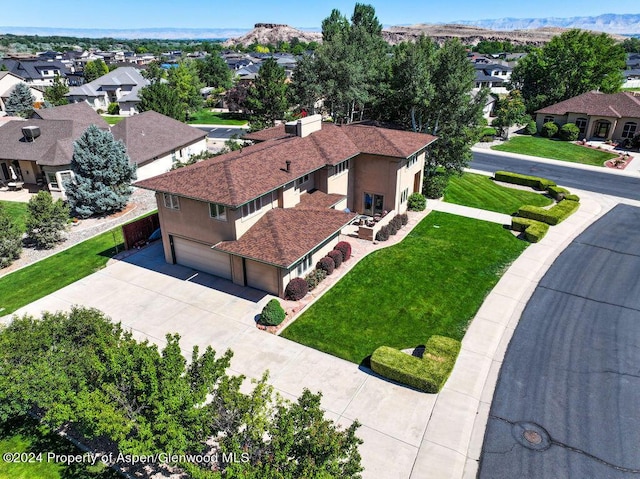 birds eye view of property with a residential view and a mountain view