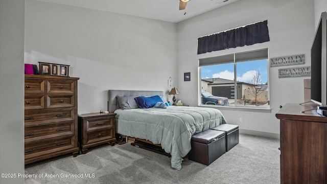 bedroom featuring a ceiling fan, carpet flooring, and baseboards