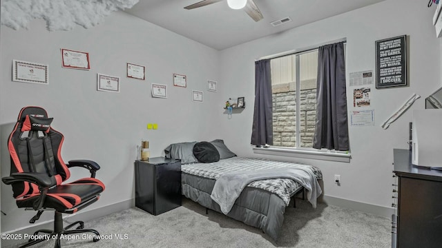 bedroom with a ceiling fan, carpet flooring, visible vents, and baseboards