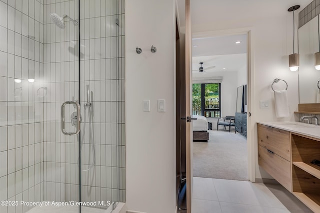 full bathroom featuring vanity, a stall shower, ensuite bathroom, and ceiling fan