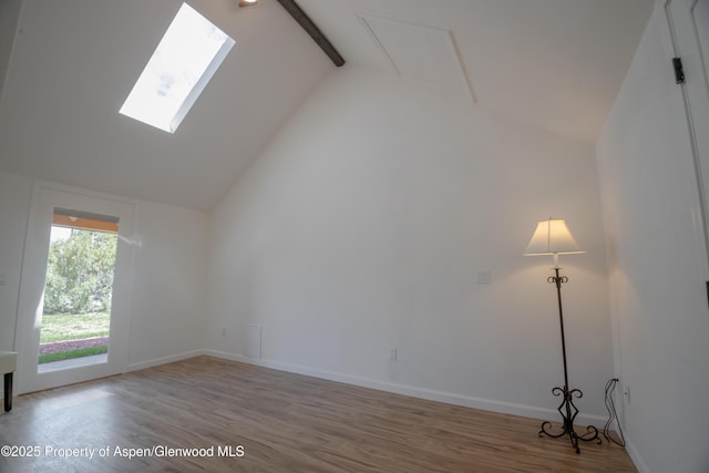 interior space featuring hardwood / wood-style flooring, high vaulted ceiling, and beamed ceiling