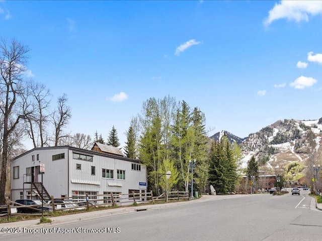 412 Mill St # B9, Aspen, CO 81611 - view of asphalt street featuring a mountain view, sidewalks, and curbs
