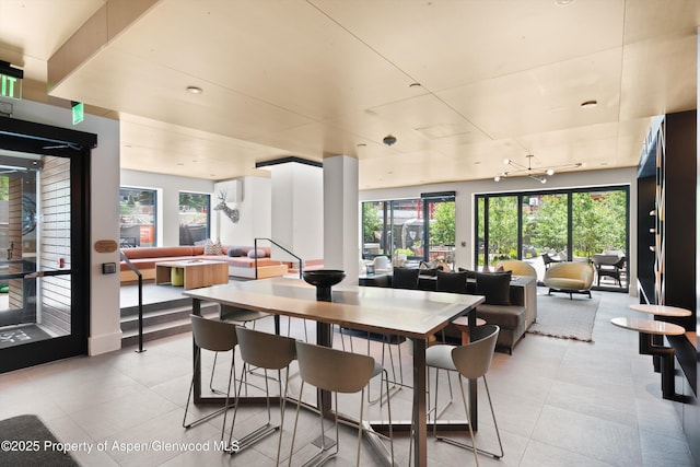 119 Wood Rd Unit 604, Snowmass Village, CO 81615 - dining area featuring healthy amount of natural light and light tile patterned floors