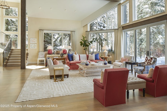 sunroom / solarium featuring plenty of natural light and a chandelier