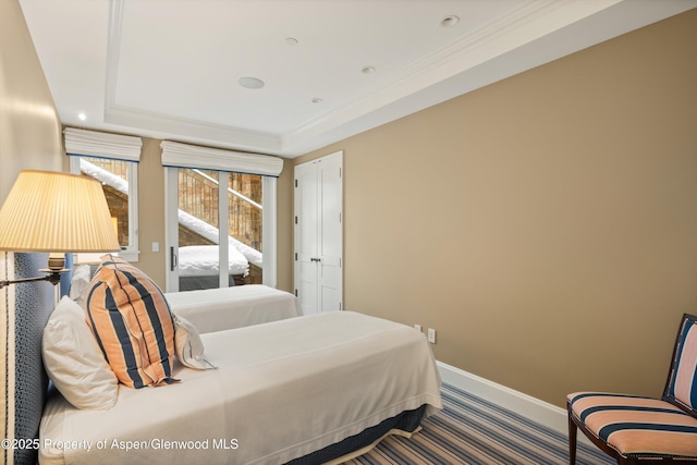 bedroom with carpet flooring, baseboards, access to outside, a raised ceiling, and crown molding