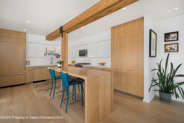 kitchen with light countertops, appliances with stainless steel finishes, modern cabinets, and white cabinets