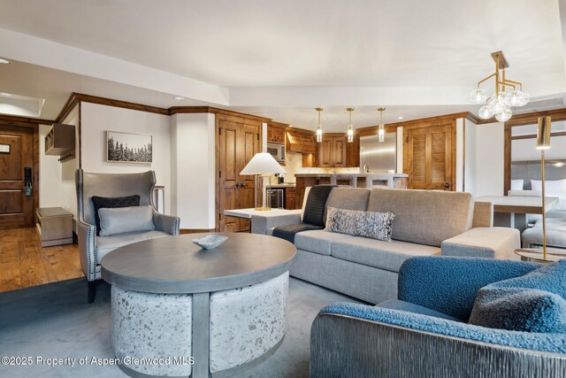 living room with beverage cooler and light hardwood / wood-style floors