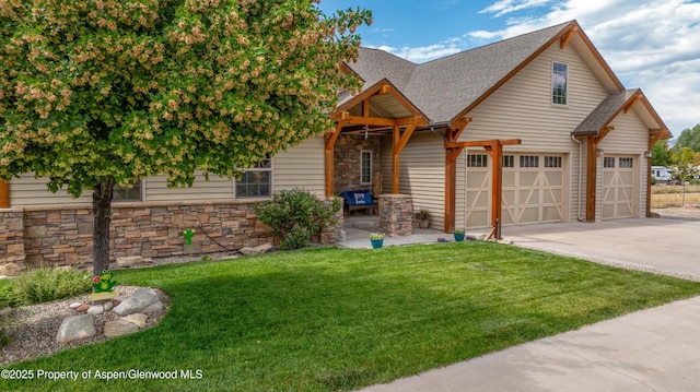 1783 Anvil View Ave, Rifle, CO 81650 - view of front of property with driveway, a front lawn, a shingled roof, and stone siding