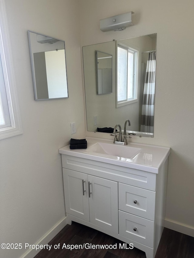 3865 W 6th St, Craig, CO 81625 - full bathroom featuring vanity and wood finished floors